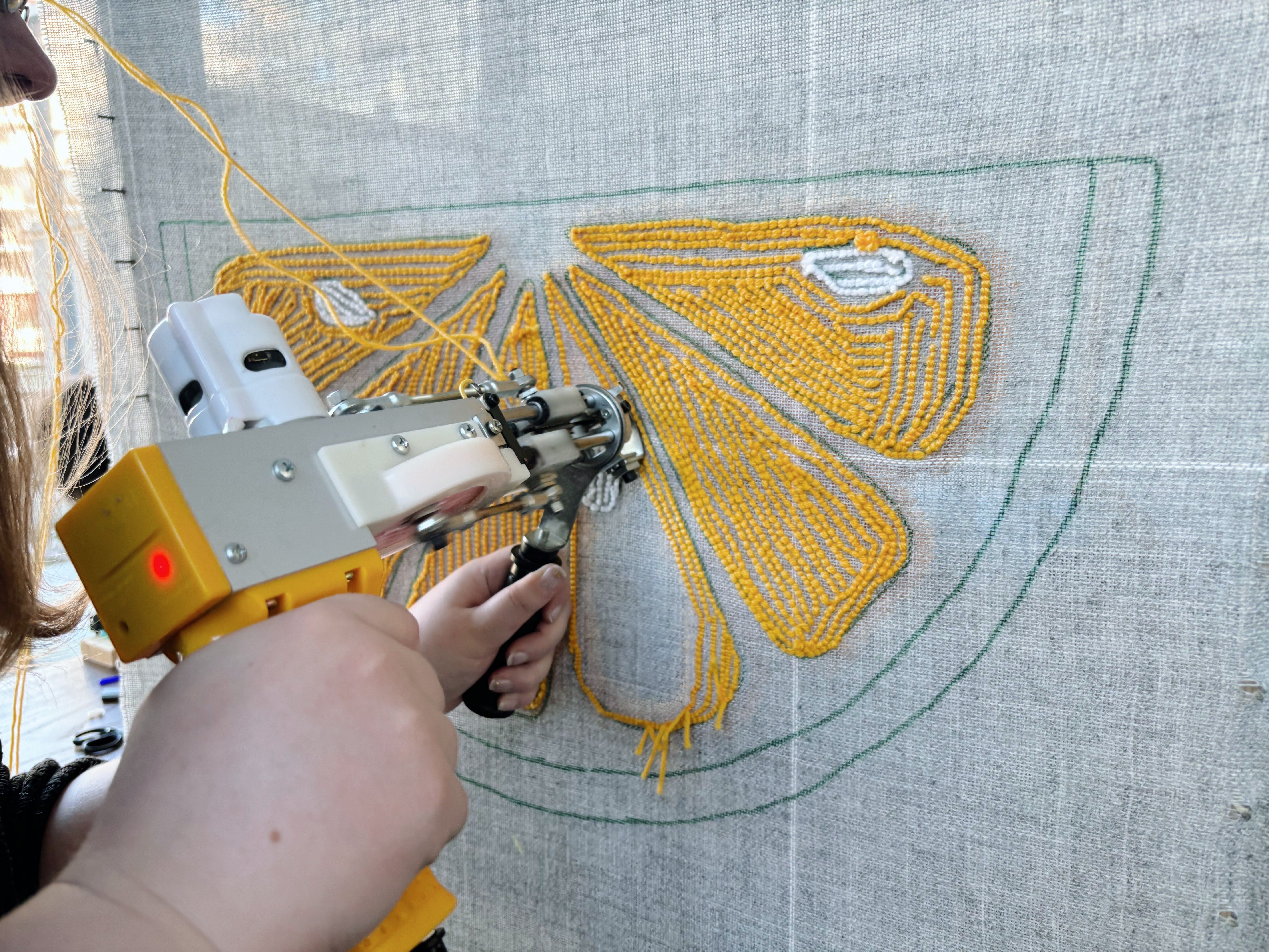 yellow tufting gun tufting a lemon