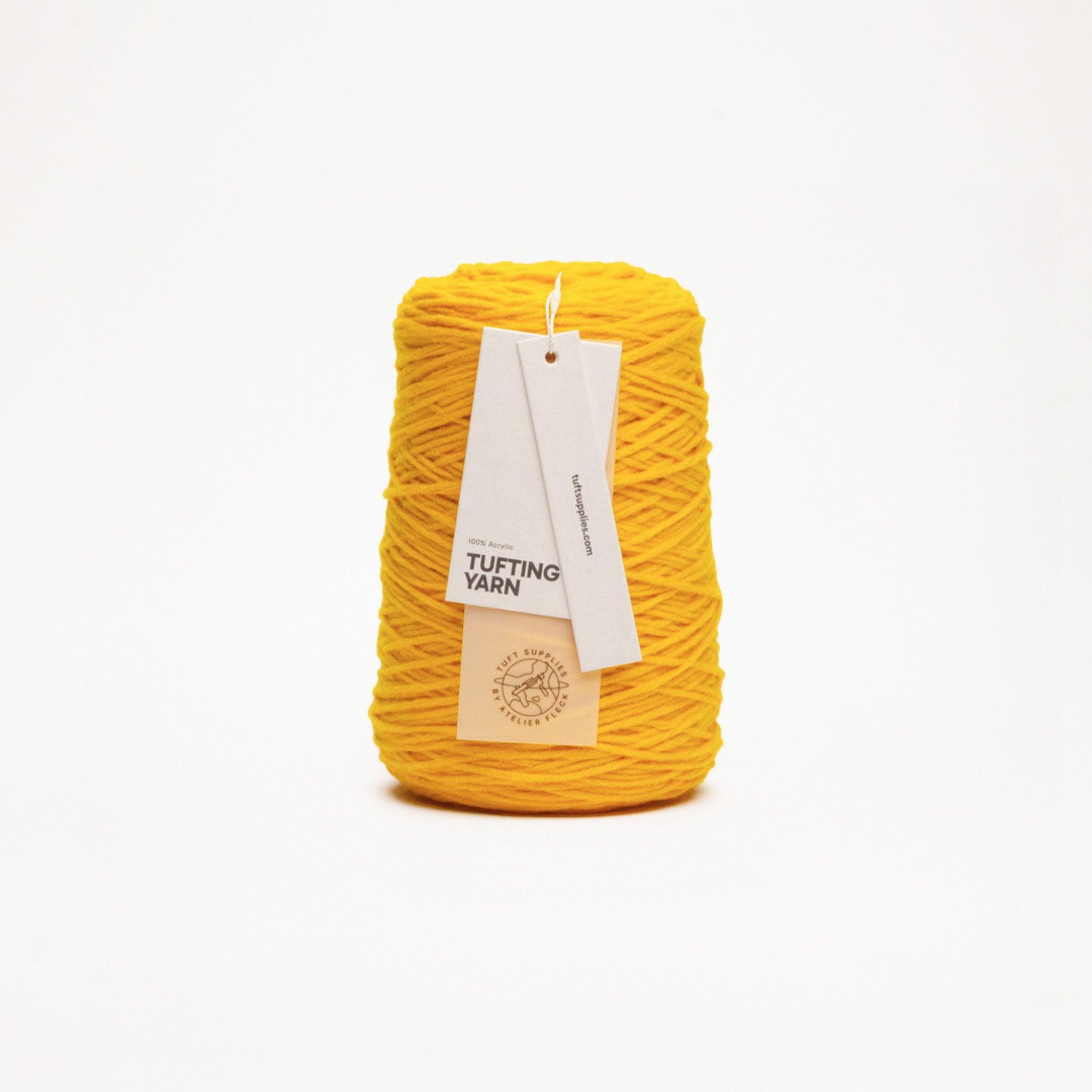 Citrus yarn in a warm and bright tone shade (Hex: #f1b52a), suitable for tufting and punch needle projects.